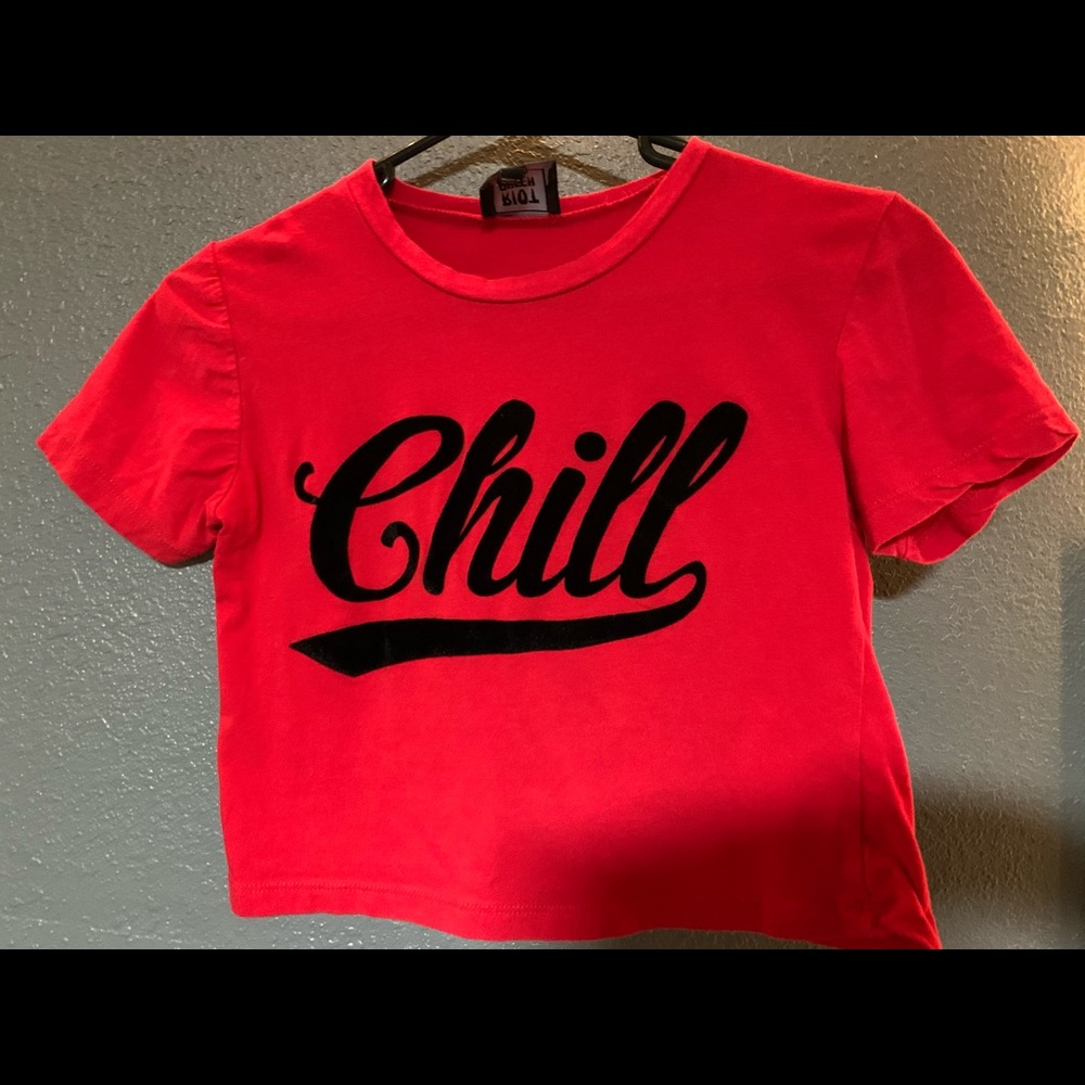 red cropped top with black logo